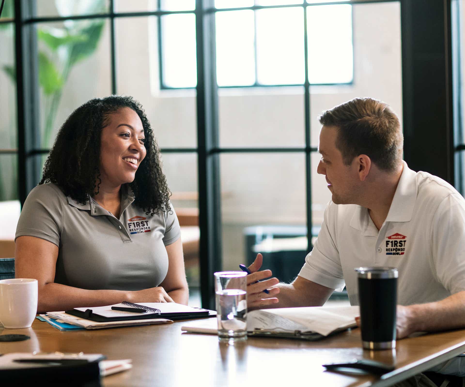2 people speaking to each other around a table at work
SERV1444 Three Year usage. Limited to Internal use at corporate on digital, social and website, with three yea print usage beginning 10/1/2021