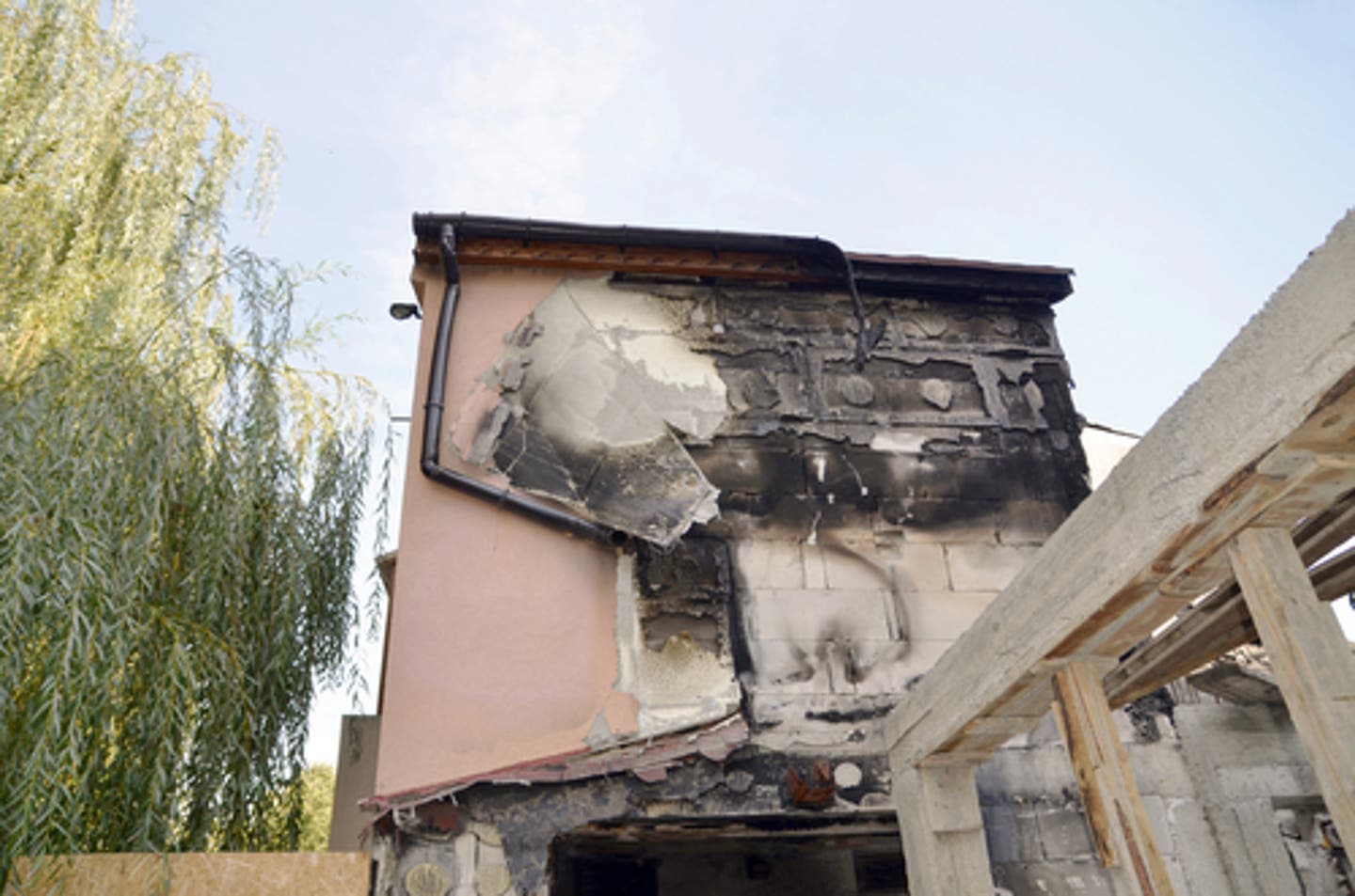 Fire damage on the side of a building. SERVPRO professionals can help you with fire damage repair and construction.